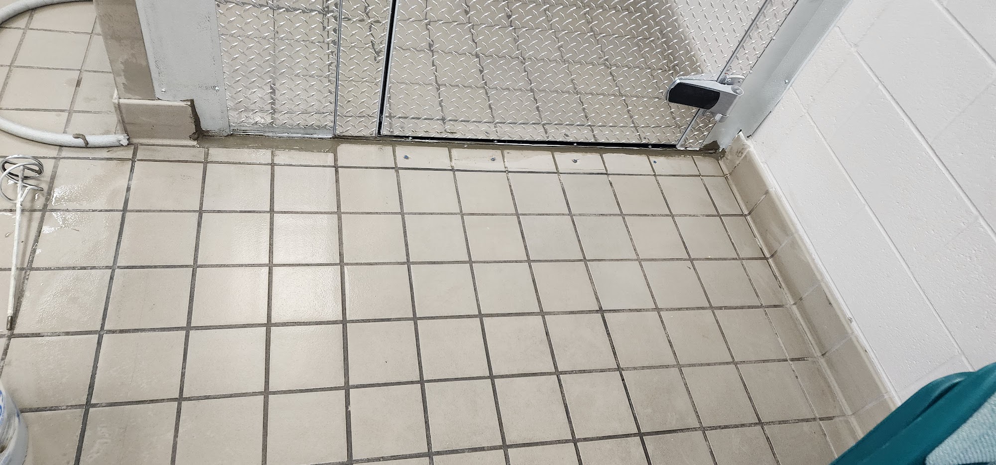 Clean tiled utility floor after cleaning service
