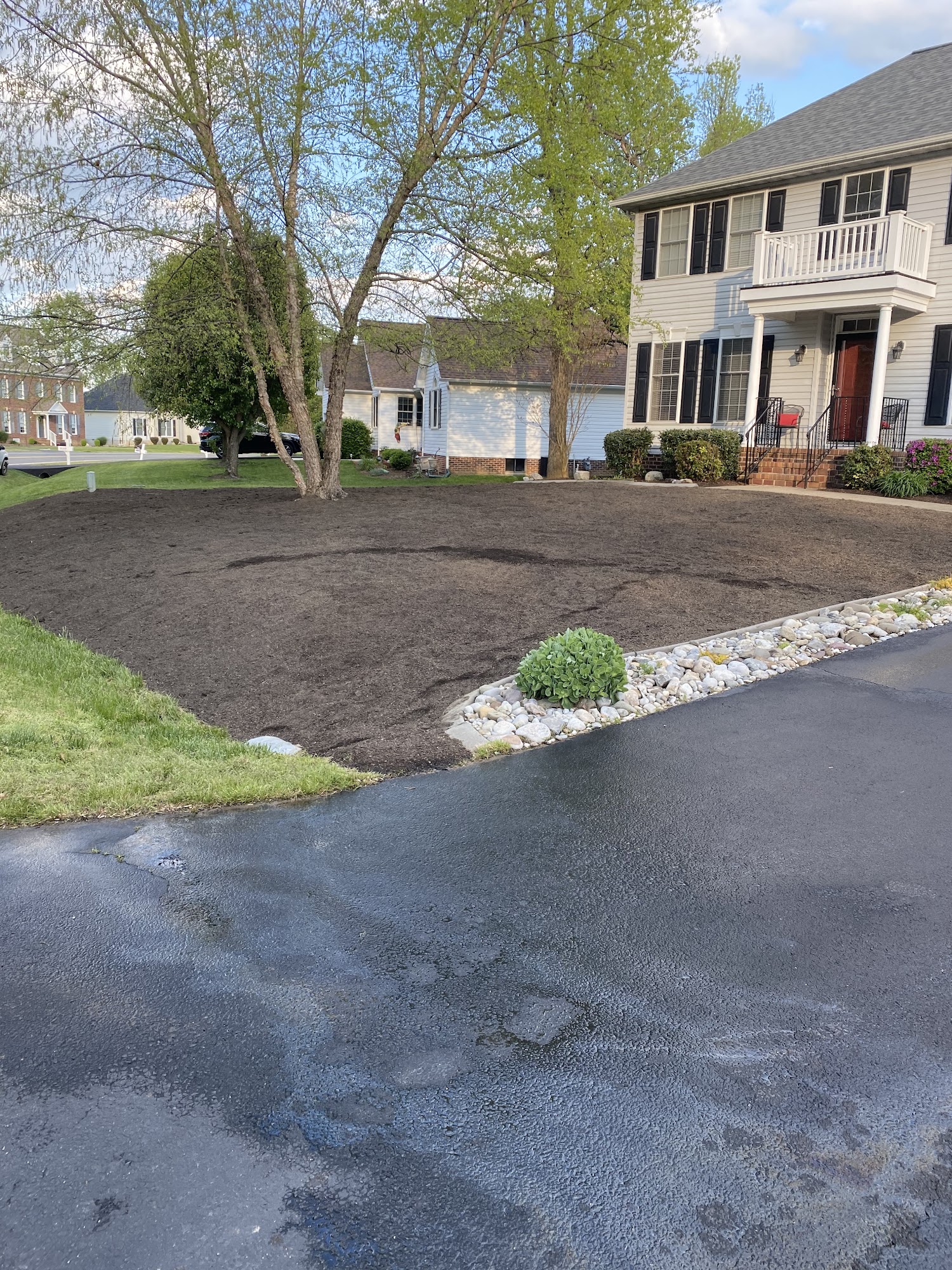 Front yard prepared with fresh dark topsoil
