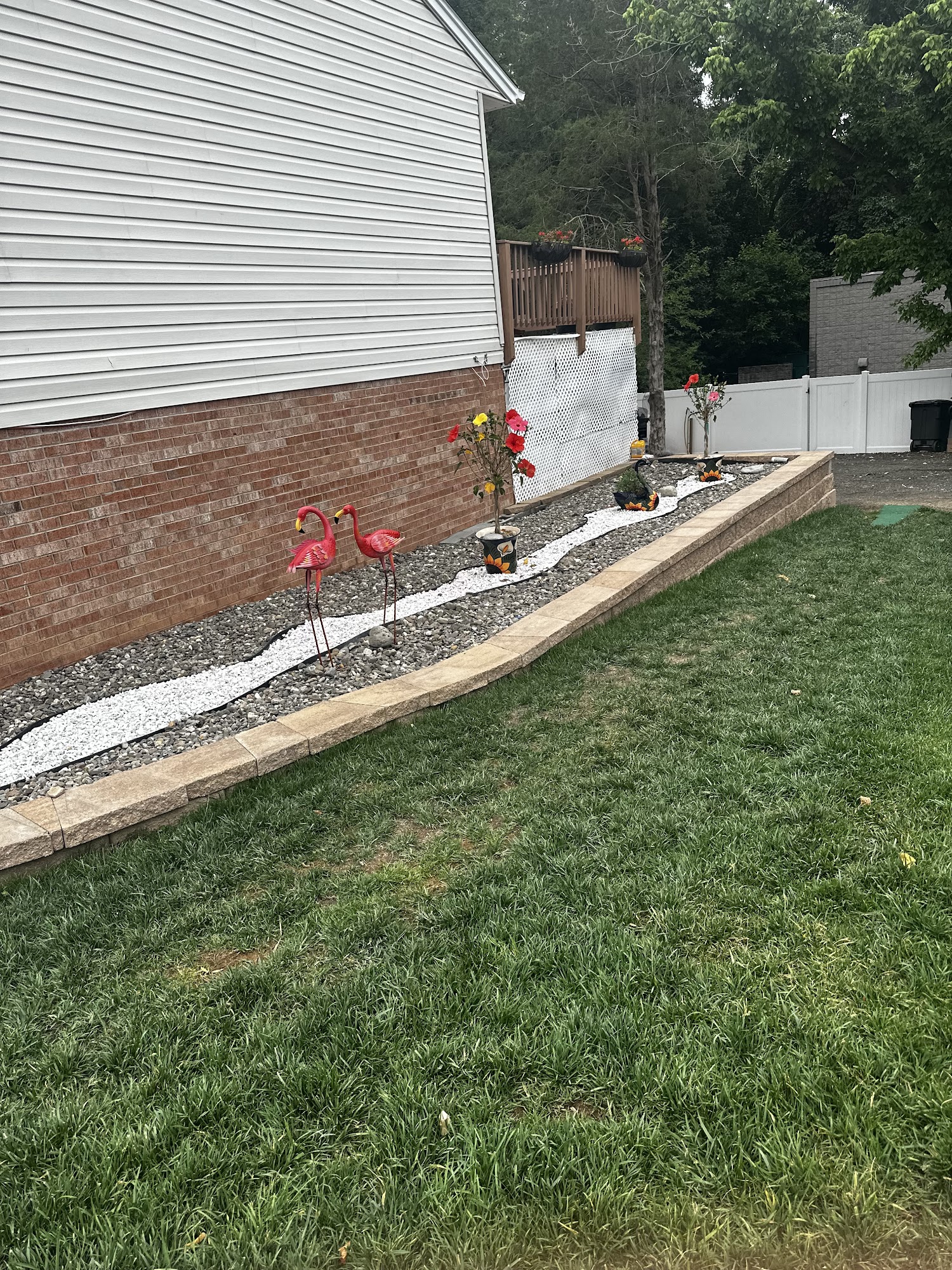 Stone and gravel border along the side of a house